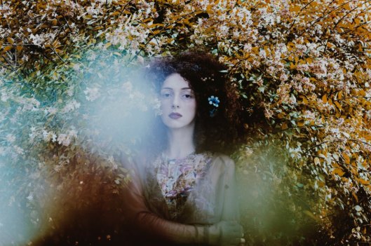 unsplash tiko-giorgadze-girl in bushes